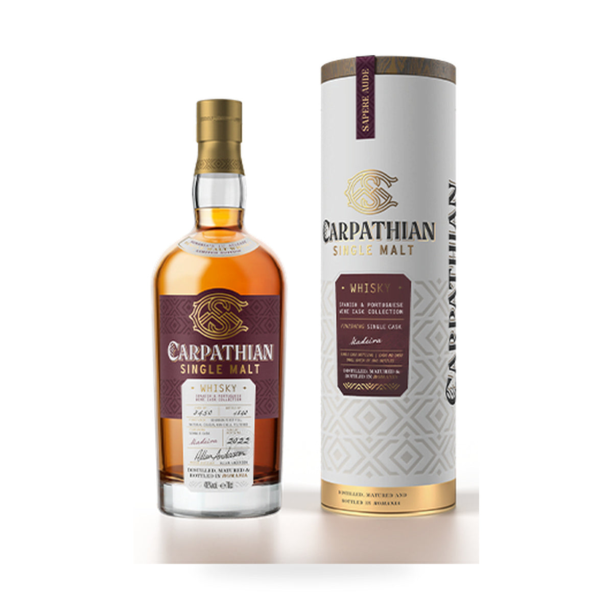 Carpathian Single Malt Whisky – Madeira Cask Finish – amber bottle beside presentation tube